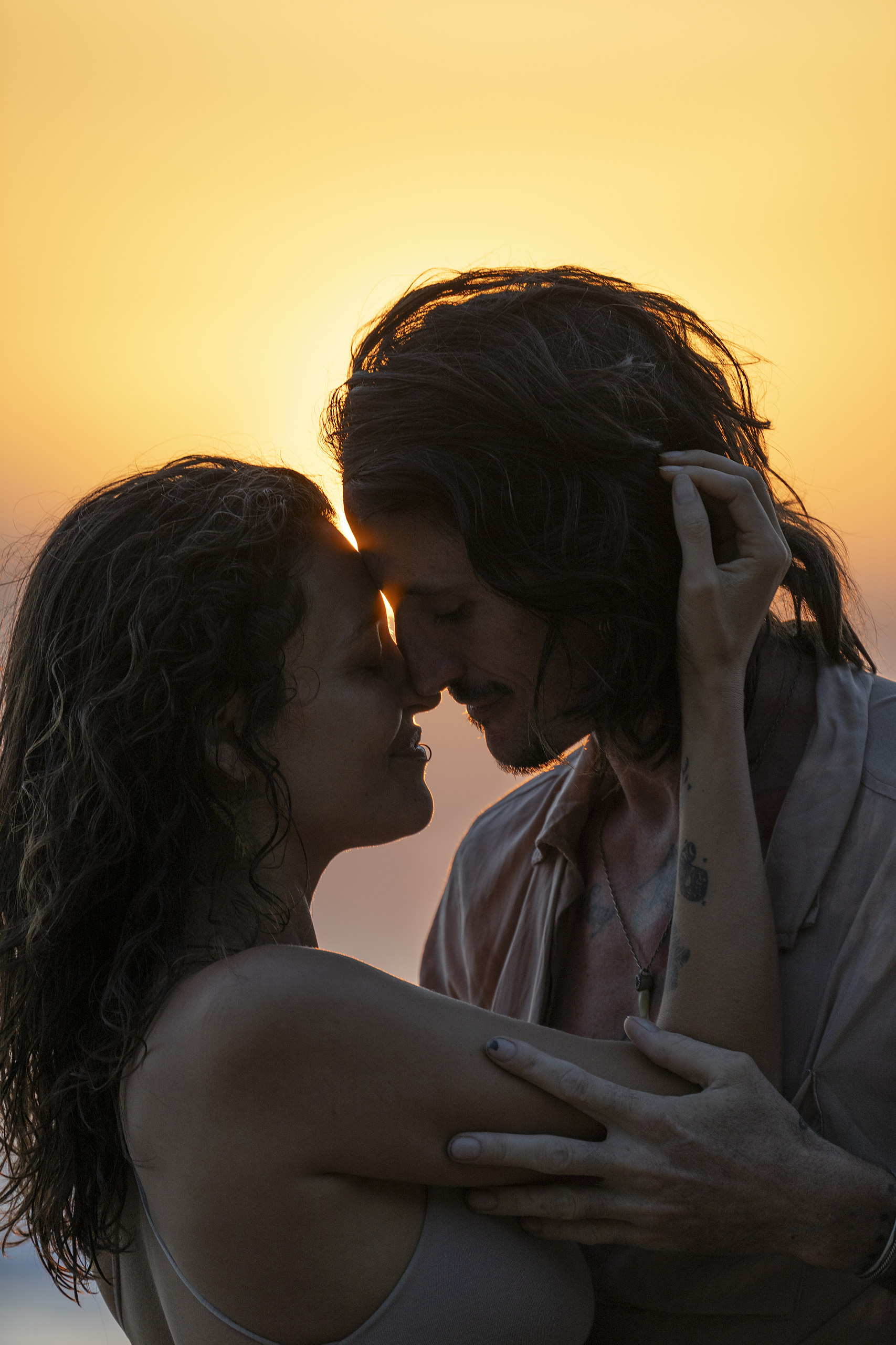 Couple embracing at sunset in the Colorado foothills