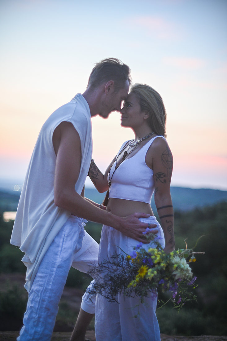Expecting couple at dusk on a Colorado overlook