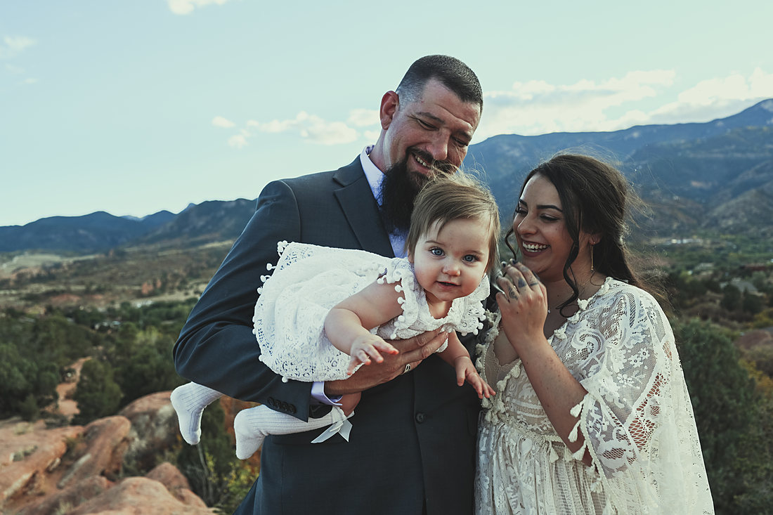 Family portrait in a mountain meadow